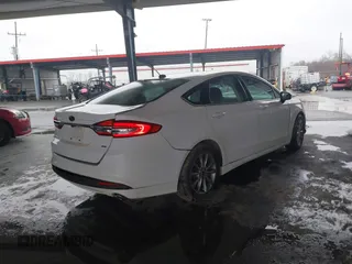 2017 Ford Fusion SE with VIN 3FA6P0H74HR196954, listed as a IAAI auction lot 41636002 with 70,366 mi miles and . Bid and sale history available at DreamBid. Image 4.