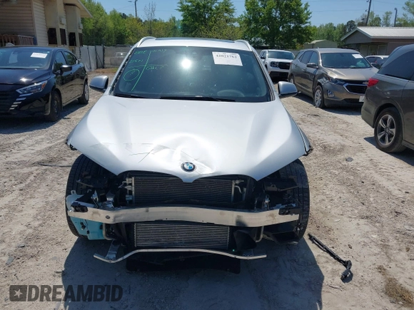 2021 BMW X1 sDrive28i with VIN WBXJG7C06M5T14235, listed as a IAAI auction lot 42021762 with 53,384 mi miles and . Bid and sale history available at DreamBid. Image 12.