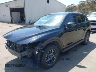 2019 Mazda CX-5 Sport with VIN JM3KFABM7K1509987, listed as a IAAI auction lot 42062804 with 50,898 mi miles and . Bid and sale history available at DreamBid. Image 2.