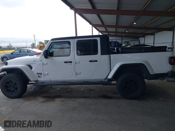 2021 Jeep Gladiator Willys with VIN 1C6HJTAG0ML505674, listed as a IAAI auction lot 42249317 with 60,150 mi miles and . Bid and sale history available at DreamBid. Image 14.