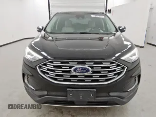 2021 Ford Edge Titanium с VIN 2FMPK4K94MBA27083, выставлен на аукционе Copart как лот 62149285 с пробегом 128 325 миль миль и Чистый • Clean title. История ставок и продаж доступна на DreamBid. Изображение 5.