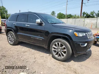 2017 Jeep Grand Cherokee Overland with VIN 1C4RJFCG9HC684850, listed as a Copart auction lot 62746974 with 0 mi miles and Salvage Title. Bid and sale history available at carsss.com. Image 4.