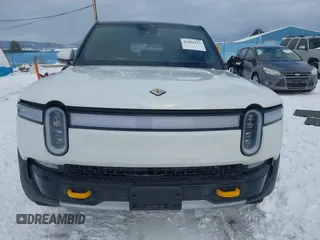 2023 Rivian R1S Adventure z VIN 7PDSGABA9PN015327, wystawiony jako IAAI lot #41484133 z przebiegiem Nie podano mil oraz . Historia ofert i sprzedaży dostępna na DreamBid. Obrazek 13.