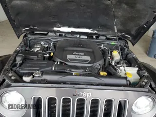 2017 Jeep Wrangler Sahara z VIN 1C4AJWBG6HL582839, wystawiony jako Copart lot #52049725 z przebiegiem 143 544 mil mil oraz Szkoda całkowita • Salvage title. Historia ofert i sprzedaży dostępna na DreamBid. Obrazek 12.