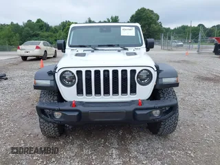 2021 Jeep Wrangler Unlimited Rubicon with VIN 1C4JJXFM9MW774142, listed as a IAAI auction lot 42625007 with 42,318 mi miles and . Bid and sale history available at DreamBid. Image 12.
