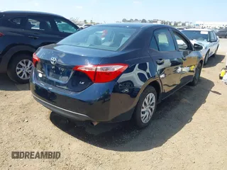 2019 Toyota Corolla L with VIN 2T1BURHE6KC185004, listed as a IAAI auction lot 42105629 with 111,907 mi miles. Bid and sale history available at carsss.com. Image 4.