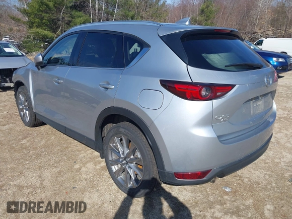 2021 Mazda CX-5 Grand Touring Reserve with VIN JM3KFBAY5M0472988, listed as a IAAI auction lot 41897855 with 27,318 mi miles. Bid and sale history available at carsss.com. Image 3.