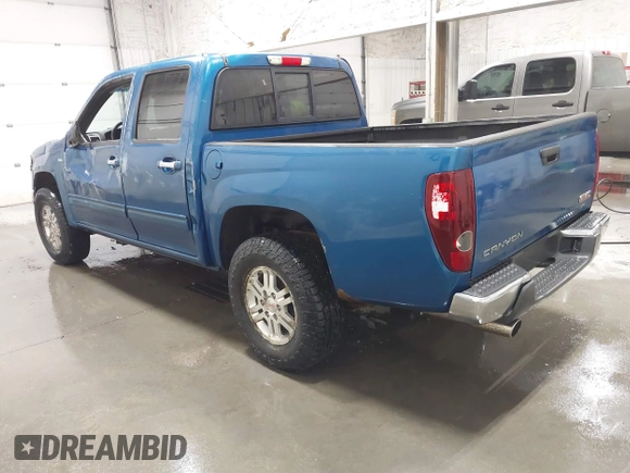 2011 GMC Canyon SLT with VIN 1GTH6NFP8B8115436, listed as a IAAI auction lot 41676023 with 148,478 mi miles. Bid and sale history available at carsss.com. Image 3.