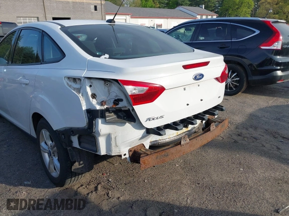 2013 Ford Focus SE z VIN 1FADP3F29DL239824, wystawiony jako IAAI lot #42219875 z przebiegiem 86 699 mil mil oraz . Historia ofert i sprzedaży dostępna na DreamBid. Obrazek 6.