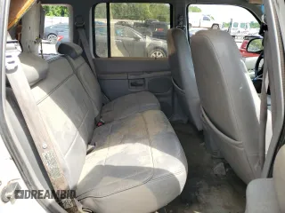 1996 Ford Explorer XL z VIN 1FMDU34X7TUD53066, wystawiony jako Copart lot #52031465 z przebiegiem 142 895 mil mil oraz Szkoda całkowita • Salvage title. Historia ofert i sprzedaży dostępna na DreamBid. Obrazek 11.