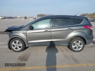 2015 Ford Escape SE with VIN 1FMCU0G73FUA77673, listed as a IAAI auction lot 41988290 with 176,734 mi miles. Bid and sale history available at carsss.com. Image 14.