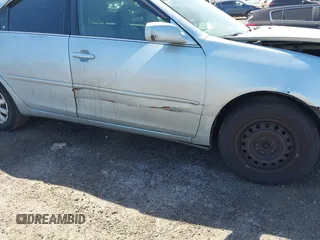 2005 Toyota Camry STD z VIN 4T1BE32K65U994854, wystawiony jako IAAI lot #42137074 z przebiegiem 104 051 mil mil oraz . Historia ofert i sprzedaży dostępna na DreamBid. Obrazek 13.