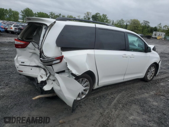 2015 Toyota Sienna LE with VIN 5TDJK3DCXFS126604, listed as a Copart auction lot 56987355 with 102,079 mi miles and Salvage title. Bid and sale history available at DreamBid. Image 3.