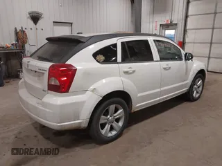 2010 Dodge Caliber SXT with VIN 1B3CB4HA3AD590654, listed as a IAAI auction lot 41814572 with 203,422 mi miles and . Bid and sale history available at DreamBid. Image 4.
