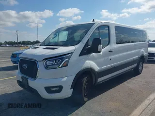 2023 Ford Transit Passenger XL with VIN 1FBAX2YG6PKB08879, listed as a IAAI auction lot 42137671 with 44,204 mi miles. Bid and sale history available at carsss.com. Image 2.