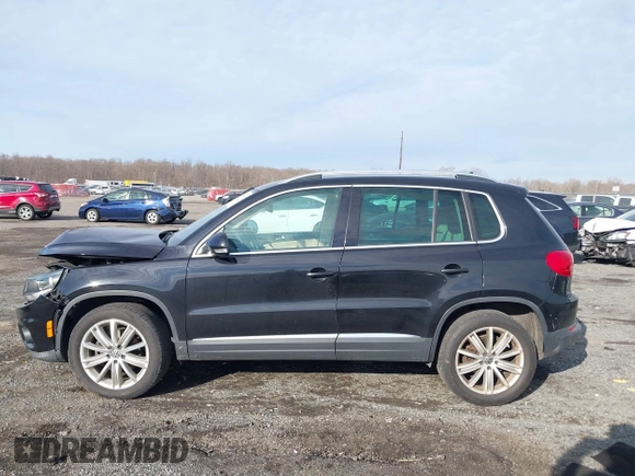 2012 Volkswagen Tiguan SE with VIN WVGAV7AX3CW531264, listed as a IAAI auction lot 41651242 with 190,669 mi miles and . Bid and sale history available at DreamBid. Image 14.