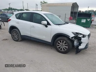 2016 Mazda CX-5 Sport with VIN JM3KE2BY1G0875484, listed as a IAAI auction lot 41838122 with 166,986 mi miles. Bid and sale history available at carsss.com. Image 1.