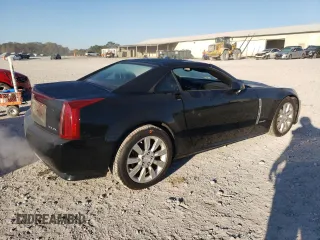 2009 Cadillac XLR Platinum z VIN 1G6YV36A395600052, wystawiony jako Copart lot #76961534 z przebiegiem 176 354 mil mil oraz Szkody całkowita. Historia ofert i sprzedaży dostępna na DreamBid. Obrazek 3.
