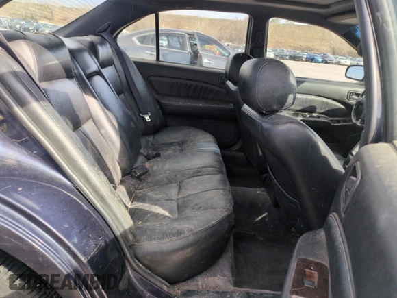 1997 Nissan Maxima GXE with VIN JN1CA21D0VT201140, listed as a Copart auction lot 52230495 with 286,440 mi miles and Clean title. Bid and sale history available at DreamBid. Image 10.