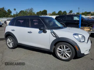 2014 MINI Countryman S with VIN WMWZC3C5XEWP25792, listed as a Copart auction lot 58583455 with 83,831 mi miles and Salvage title. Bid and sale history available at DreamBid. Image 4.