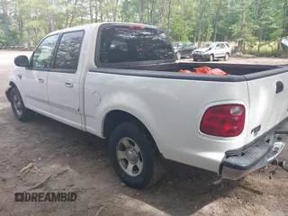 2003 Ford F-150 XLT with VIN 1FTRW07663KD69809, listed as a IAAI auction lot 42198549 with 166,466 mi miles and . Bid and sale history available at DreamBid. Image 3.
