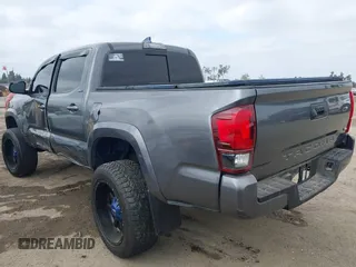 2018 Toyota Tacoma SR5 with VIN 5TFAZ5CNXJX066952, listed as a IAAI auction lot 41894562 with 141,818 mi miles and . Bid and sale history available at DreamBid. Image 3.