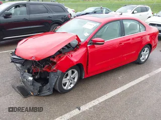 2014 Volkswagen Jetta TDI w/Premium/Nav with VIN 3VWLL7AJ4EM383351, listed as a IAAI auction lot 42424074 with 66,824 mi miles and . Bid and sale history available at DreamBid. Image 2.