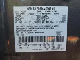 2007 Ford F-150 STX with VIN 1FTRX12W97KD12990, listed as a Copart auction lot 46939335 with 216,759 mi miles and Salvage Title. Bid and sale history available at DreamBid. Image 12.