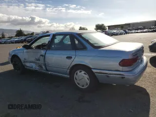 1993 Ford Taurus z VIN 1FACP5216PG197713, wystawiony jako Copart lot #80982424 z przebiegiem 79 330 mil mil oraz Szkoda całkowita • Salvage title. Historia ofert i sprzedaży dostępna na DreamBid. Obrazek 2.