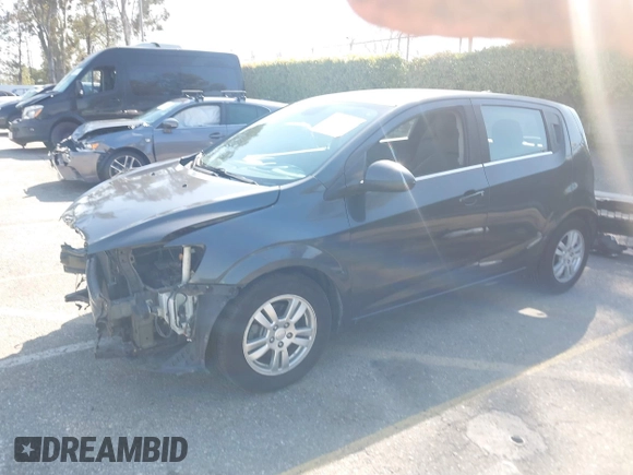 2014 Chevrolet Sonic LT with VIN 1G1JC6SG4E4118781, listed as a IAAI auction lot 41862192 with 124,375 mi miles. Bid and sale history available at carsss.com. Image 2.