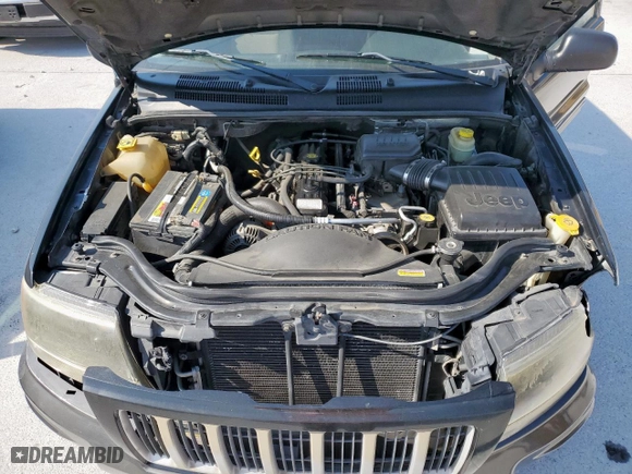 2004 Jeep Grand Cherokee Laredo with VIN 1J4GX48S24C303786, listed as a Copart auction lot 53482155 with 167,823 mi miles and Salvage Title. Bid and sale history available at carsss.com. Image 12.