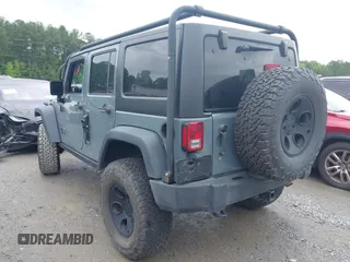 2015 Jeep Wrangler Unlimited Sport with VIN 1C4HJWDG1FL635620, listed as a IAAI auction lot 42396137 with 87,352 mi miles and . Bid and sale history available at DreamBid. Image 3.