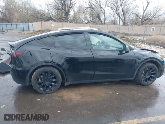 2023 Tesla Model Y Long Range with VIN 7SAYGDEE5PF766685, listed as a IAAI auction lot 41933729 with 25,959 mi miles and . Bid and sale history available at DreamBid. Image 12.