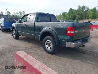 2005 Ford F-150 XLT with VIN 1FTPX14555NA51705, listed as a IAAI auction lot 42098365 with 162,409 mi miles. Bid and sale history available at carsss.com. Image 3.