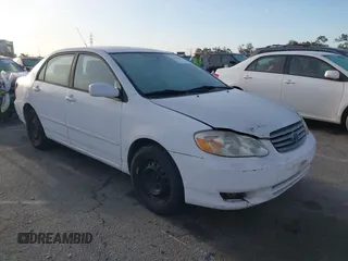2004 Toyota Corolla CE with VIN JTDBR32E042025208, listed as a IAAI auction lot 41934485 with 299,999 mi miles. Bid and sale history available at carsss.com. Image 1.
