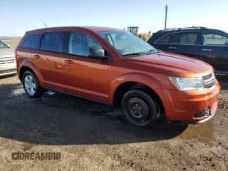 2013 Dodge Journey American Value with VIN 3C4PDCAB4DT590975, listed as a Copart auction lot 55627725 with 212,659 mi miles and Clean Title. Bid and sale history available at DreamBid. Image 4.