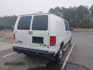 2012 Ford Econoline Cargo Recreational with VIN 1FTNE2EW8CDA64042, listed as a IAAI auction lot 42197470 with 130,647 mi miles. Bid and sale history available at carsss.com. Image 4.