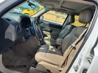 2015 Jeep Patriot High Altitude with VIN 1C4NJRFB5FD114125, listed as a Copart auction lot 62475615 with 104,438 mi miles and Salvage title. Bid and sale history available at DreamBid. Image 7.