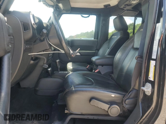 2015 Jeep Wrangler Unlimited Rubicon z VIN 1C4BJWFG2FL530863, wystawiony jako Copart lot #56345965 z przebiegiem 149 754 mil mil oraz Szkoda całkowita • Salvage title. Historia ofert i sprzedaży dostępna na DreamBid. Obrazek 7.