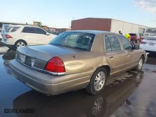 2005 Ford Crown Victoria LX with VIN 2FAFP74W55X130190, listed as a IAAI auction lot 41138306 with 122,738 mi miles. Bid and sale history available at carsss.com. Image 4.
