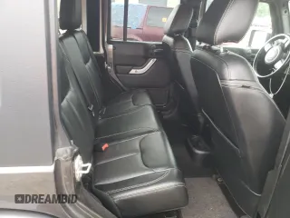 2018 Jeep Wrangler JK Unlimited Sahara with VIN 1C4HJWEG7JL909023, listed as a Copart auction lot 72774404 with 106,801 mi miles and Salvage Title. Bid and sale history available at carsss.com. Image 11.