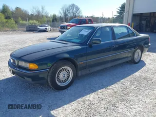 1998 BMW 7 Series 740il with VIN WBAGJ8323WDM13455, listed as a IAAI auction lot 41888636 with 1 mi miles. Bid and sale history available at carsss.com. Image 2.