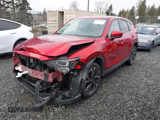 2023 Mazda CX-5 2.5 S Premium Package with VIN JM3KFBDM1P0161605, listed as a IAAI auction lot 41626777 with 26,581 mi miles. Bid and sale history available at carsss.com. Image 2.