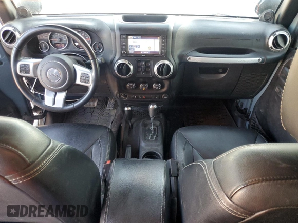 2014 Jeep Wrangler Unlimited Rubicon with VIN 1C4HJWFG9EL199501, listed as a Copart auction lot 61443595 with 86,940 mi miles and Salvage title. Bid and sale history available at DreamBid. Image 8.