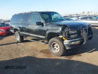 1999 GMC Suburban with VIN 3GKEC16R7XG527908, listed as a IAAI auction lot 41657788 with 216,894 mi miles. Bid and sale history available at carsss.com. Image 1.