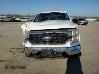 2021 Ford F-150 XL with VIN 1FTEW1CP8MFD11312, listed as a Copart auction lot 88754605 with 142,224 mi miles and Salvage title. Bid and sale history available at DreamBid. Image 11.