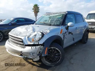 2015 MINI Countryman with VIN WMWZB3C56FWR43359, listed as a IAAI auction lot 40720320 with 69,898 mi miles and . Bid and sale history available at DreamBid. Image 2.