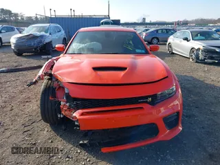 2022 Dodge Charger Scat Pack Widebody with VIN 2C3CDXGJ3NH101081, listed as a IAAI auction lot 41351466 with 9,575 mi miles and . Bid and sale history available at DreamBid. Image 12.