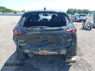2020 Mazda CX-5 Grand Touring with VIN JM3KFADM9L1837183, listed as a IAAI auction lot 42340628 with 81,975 mi miles and . Bid and sale history available at DreamBid. Image 16.