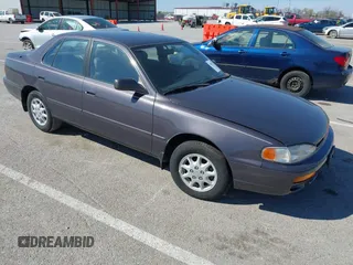 1996 Toyota Camry DX with VIN 4T1BG12K8TU915891, listed as a IAAI auction lot 41874731 with 57,564 mi miles. Bid and sale history available at carsss.com. Image 1.